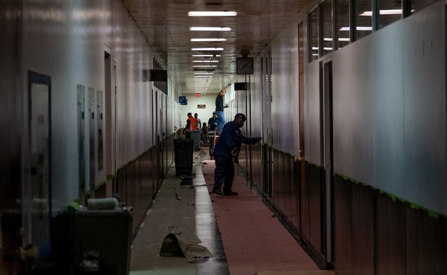 Painters work to refurbish the office space of the Lordstown Motors body and stamping facility.