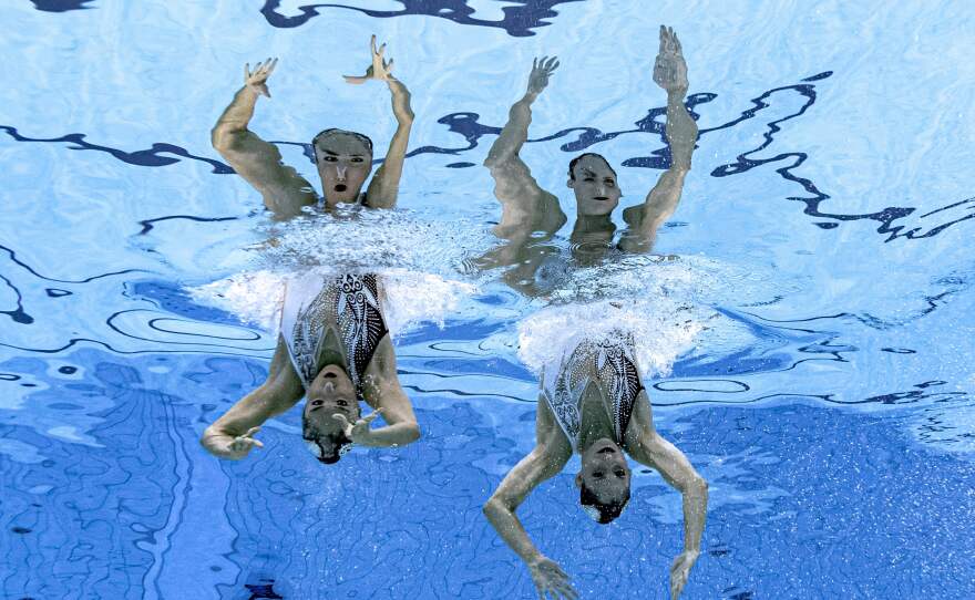 An underwater view shows Mexico's Nuria Diosdado Garcia and Mexico's Joana Jimenez Garcia compete in the preliminary for the women's duet free artistic swimming event on August 2.