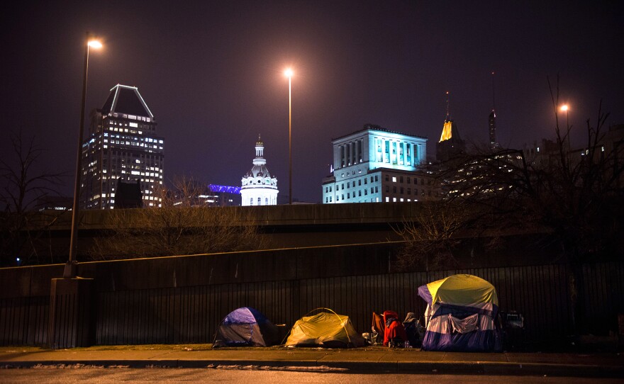 Tents set up by the side of a freeway in Baltimore, as seen during Simmons' "justice walk" with a group of Johns Hopkins students.