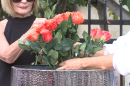 Roses are placed in a vase as a memorial for the 144 victims of PSA Flight 182 on the 47th anniversary of the jet crash in the North Park neighborhood of San Diego, Calif., on Sept. 25, 2025.
