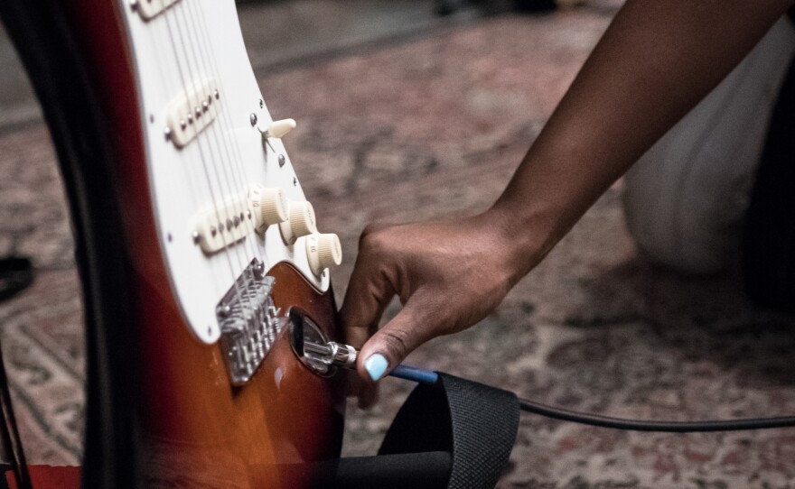 Tamko's parents eventually surprised her with an acoustic guitar when she was 17, just about to graduate. She remembers screaming when she found the instrument in the bathroom (still in its box from Costco) and then setting to work learning how to play it.