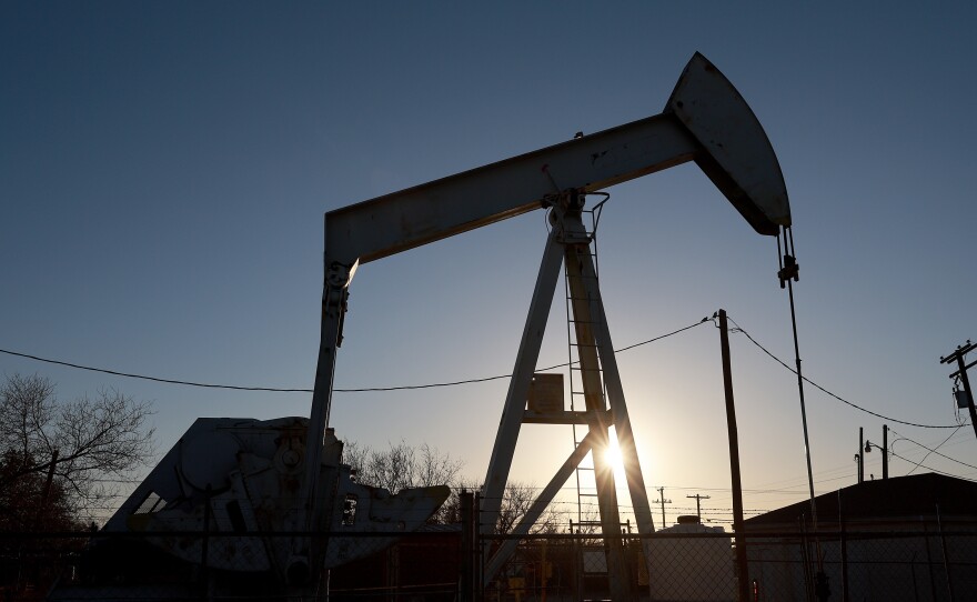 An oil pump jack pulls oil from the Permian Basin oil field on March 14, in Odessa, Texas.