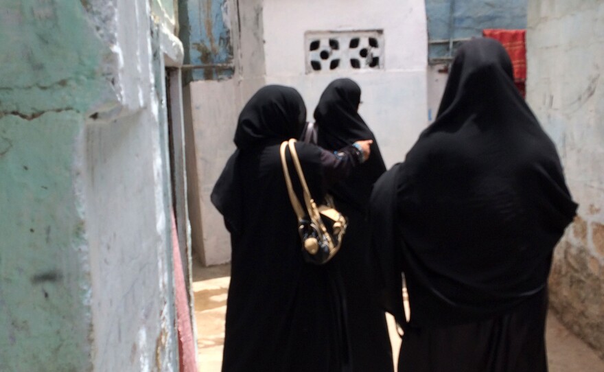 Fatima Noor (right) says she's "scared" of attacks by the Taliban. But they don't keep her and her colleagues from going door to door to give children basic health services in Karachi, Pakistan.