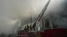 Firefighters fight a warehouse fire in the Boyle Heights neighborhood of Los Angeles, Sunday, June 21, 2026.