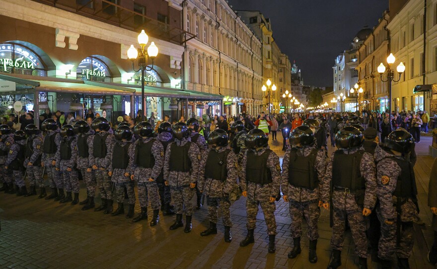 Russian police officers stand guard during an unsanctioned rally, after opposition activists called for street protests against the mobilization of reservists ordered by President Vladimir Putin, in Moscow, Russia Sept. 21, 2022.