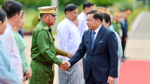 In this photo released by Myanmar President Office, Myanmar President Min Aung Hlaing, right, shakes hands with Commander-in-Chief Gen. Ye Win Oo, left, upon his departure to Vietnam, at the Naypyitaw international airport Friday, Sept. 4, 2026, in Naypyitaw, Myanmar.