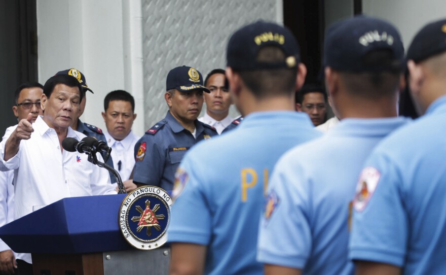 Philippine President Rodrigo Duterte berates police officers at the presidential palace in Manila on Feb. 7, after learning of the murder of a South Korean businessman. In expletive-laden remarks, Duterte told police he'd send them to a southern island to fight extremists from the Abu Sayyaf terrorist group.