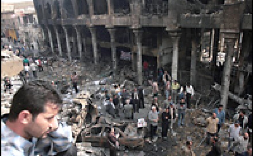 Iraqi intellectuals gather amid the ruins of Baghdad's al-Mutanabi street on March 8. Baghdad poets presented readings on the remains of the street, which was hit by a car bomb March 6, claiming the lives of more than 100 people.