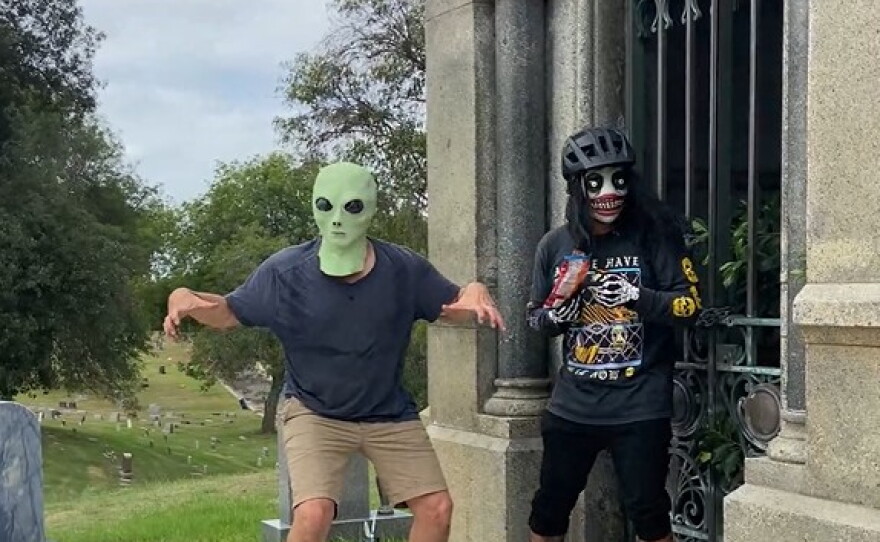Costumed riders from the 2025 Stay Strange San Diego's Cemetery Creep at Mount Hope Cemetery.