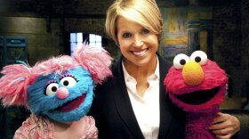 Katie Couric (center), Jessie (left) and Elmo (right) help families cope with the death of a parent.