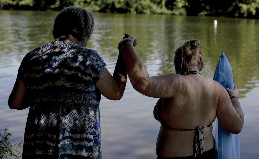 Alicia Forbit and her sister-in-law Madison take a swim in the river after visiting her Chris, Alicia's husband, in prison. "We make memories that he will never be part of because we can't stop living and having fun while he is in prison." Alicia said.