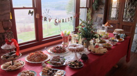 A decorated table loaded up with a small Christmas tree, holiday treats including a sweet potato cake, holiday-themed lollipops and a closely guarded family eggnog. Hosted by culinary artist and public-radio personality Carole Murko, "Heirloom Meals Christmas" celebrates the holiday season by delving into America's rich and diverse culinary history and honoring tried-and-true recipes and dining traditions.