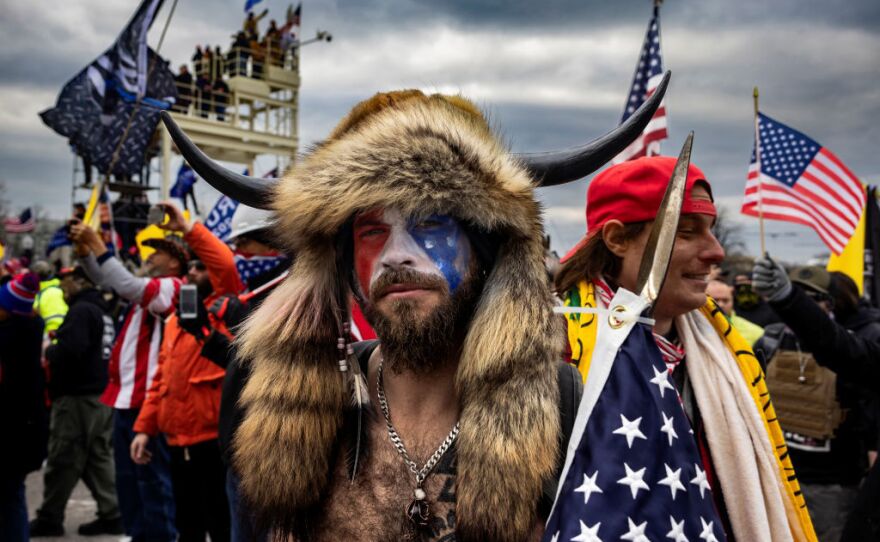 Jacob Anthony Angeli Chansley, known as the QAnon Shaman, is seen at the Capitol riots. Gonell says what he witnessed as he guarded the west entrance to the Capitol was like a "medieval battleground."