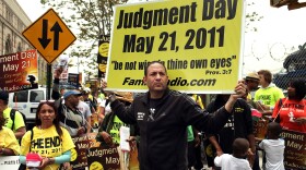 Participants in a movement that is proselytizing that the world will end this May 21, Judgment Day, gather on a street corner on May 13, 2011 in New York City. 