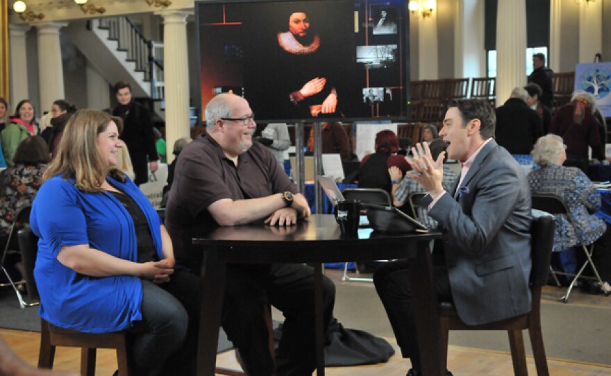 Mike Harper (center) and wife Armida Harper (left) with host Joshua Taylor (right).