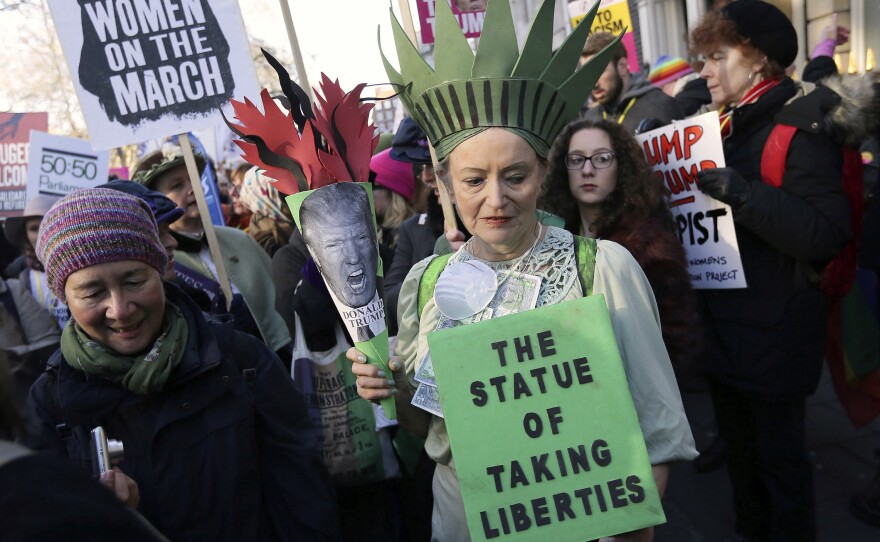 Demonstrators take part in the Women's March on London on Saturday.