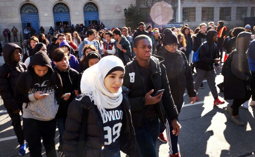 Hundreds of students walk out of Midwood High School on Wednesday, as part of a nationwide protest against gun violence in Brooklyn.