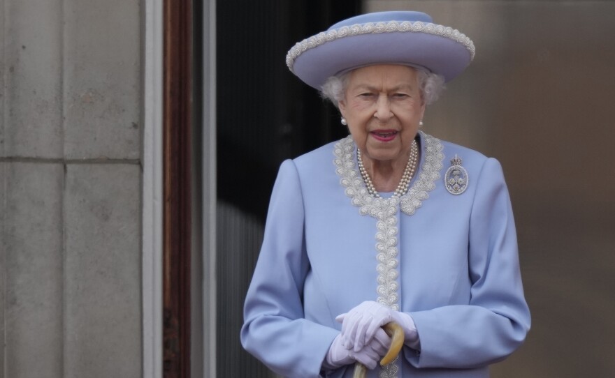 Queen Elizabeth II walks on the balcony of Buckingham Palace in London on June 2, 2022, the first of four days of celebrations to mark the Platinum Jubilee.