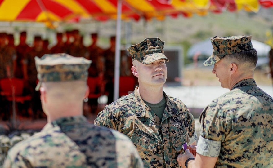 Lt. Col Matthew Ritchie pins a Purple Heart onto Hardebeck during the award ceremony. Originally created by George Washington in 1782 as the Badge of Military Merit, the Purple Heart is presented to service members who are killed or wounded in combat.