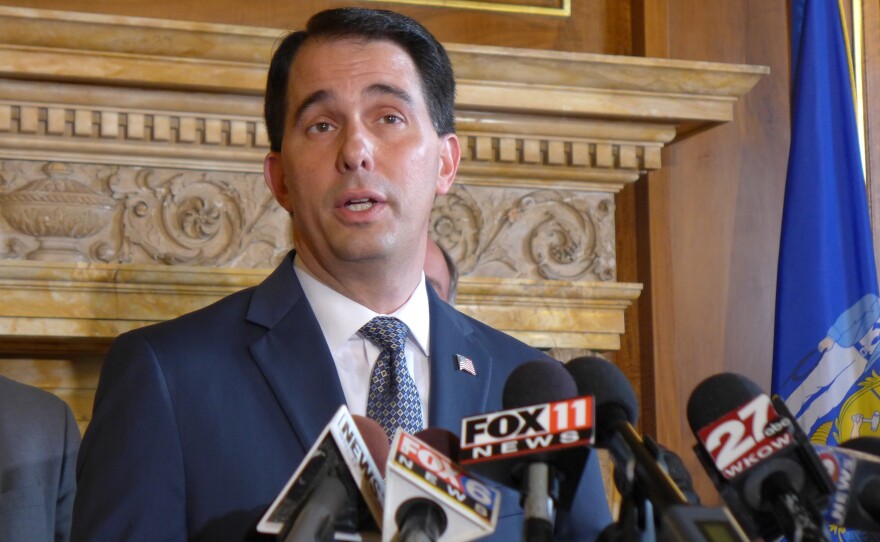 Republican Gov. Scott Walker says Wisconsin law doesn't require him to hold special elections for two legislative seats, which some say his party could have trouble keeping.