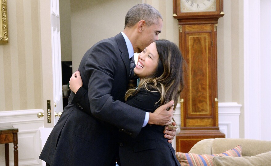 President Obama and Dallas nurse Nina Pham embrace in the Oval Office on Friday.