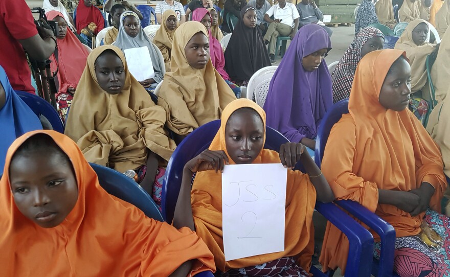 School girls set free by their Boko Haram kidnappers are photographed during a handover to government officials in Maiduguri on Wednesday.