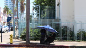 A person experiencing homelessness in downtown San Diego.
