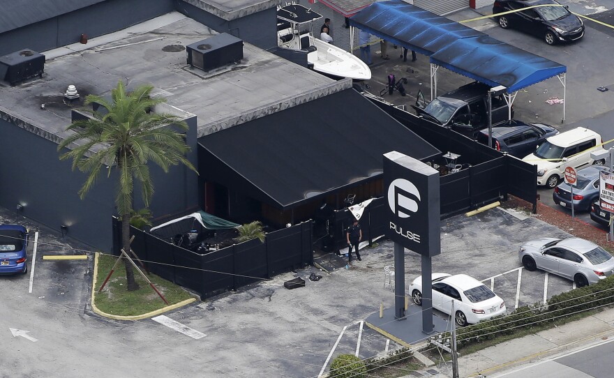 Investigators work at the Pulse nightclub in Orlando, Fla., following a mass shooting in June 2016. A California judge has ruled that Noor Salman, the widow of the gunman, Omar Mateen, can be released pending her trial on charges of aiding her husband's attack.