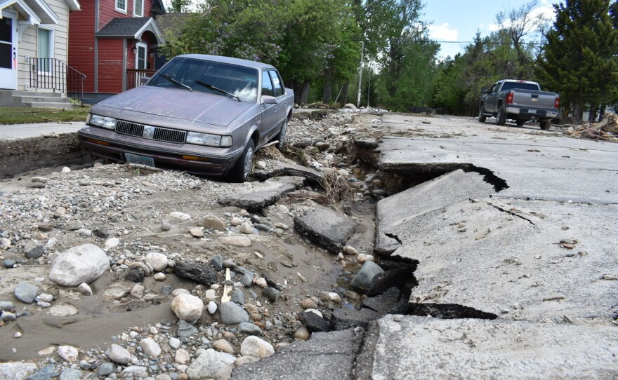 Flood damage is seen along a street Tuesday, June 14, 2022, in Red Lodge, Mont.