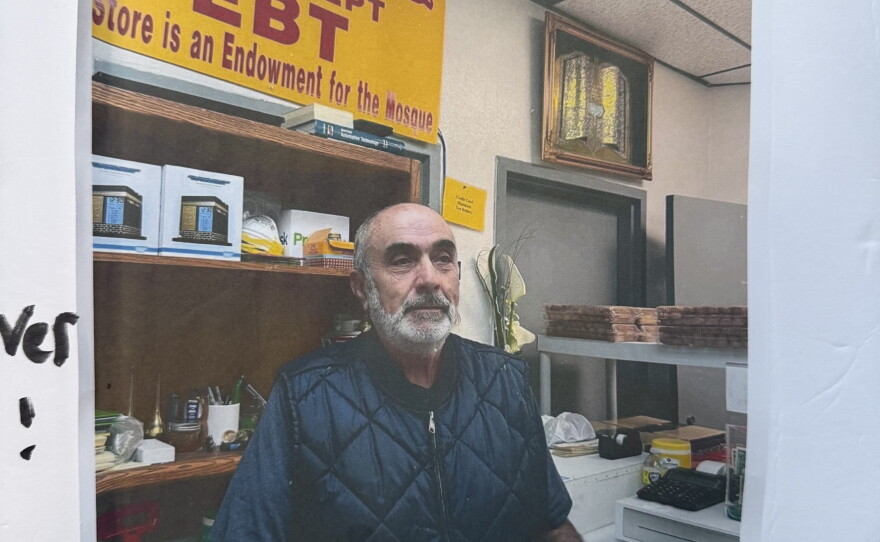 A photo of Mansour Kaziha taped onto a poster board and shown at a vigil by children who attended the Islamic Center of San Diego.