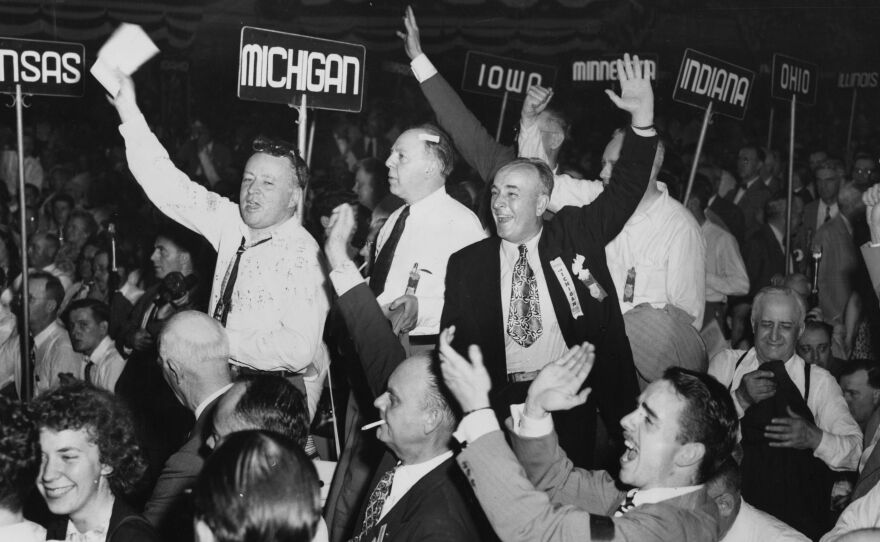 Members of the Michigan delegation at the Republican National Convention in Philadelphia jump to their feet and cheer as Thomas Dewey's landslide victory as Republican nominee for president is announced.