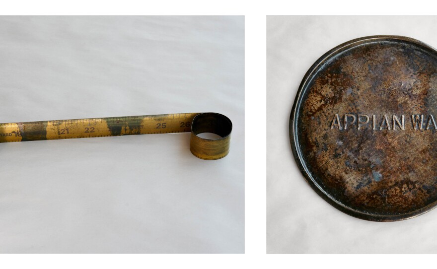 Left: Metal snap roll yard stick from the Grinker childhood home, circa 1960 that Lori loved to play with. Right: Appian Way pizza pan-one of the objects that got Lori started on this project. Audrey used this all the time starting during Lori's childhood to heat up food in the oven. The pan was part of a kit from the first mass-produced pizza pie mix in a box in the United States, circa 1950's.