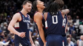 UConn guard Braylon Mullins, right, celebrates his game winning basket with guard Malachi Smith (0) during the second half in the Elite Eight of the NCAA college basketball tournament against Duke, Sunday, March 29, 2026, in Washington.