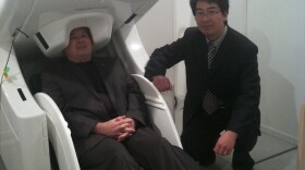 Mingxiong Huang PHD with his research subject, Col. G.I. Wilson, in the MEG brain scanner at UCSD's radiology lab. May 11th 2011 