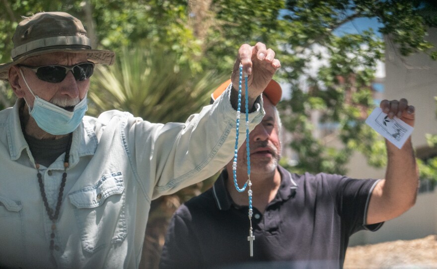 Protesters who oppose abortion rights hold crucifixes outside Southwestern Women's Options in Albuquerque, N.M.