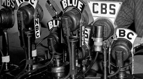 Network microphones on the desk as President Franklin D. Roosevelt addresses the nation from the White House in Washington on April 28, 1942.