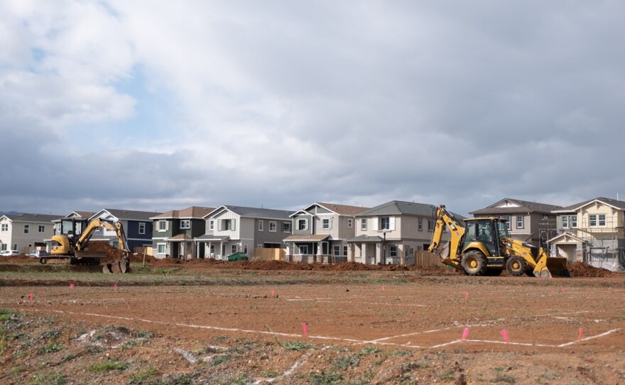 Machines ready land for development in Winters, Calif. on Monday, March 8, 2021.