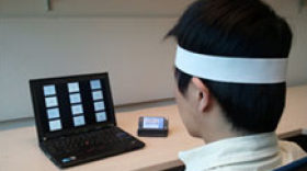 A student tests a new brain-wave cell phone app. 