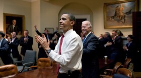 In this photo provided by the White House, U.S. President Barack Obama (C), Vice President Joe Biden (R), and senior staff applaud in the Roosevelt Room of the White House, as the U.S. House of Representatives passed the health care reform legislation March 21, 2010 in Washington, DC. The proposed legislation has become the signature piece of Obama's domestic policy agenda and has eluded U.S. presidents dating back to Theodore Roosevelt.