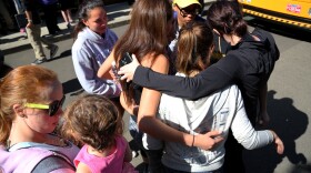 Friends and family are reunited with students at the local fairgrounds after a mass shooting at Umpqua Community College, in Roseburg, Oct. 1, 2015.