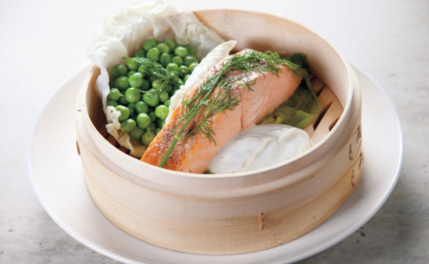 Martha Stewart uses a bamboo steamer to prepare steamed salmon and peas (pictured) simultaneously for a quick and easy dinner.