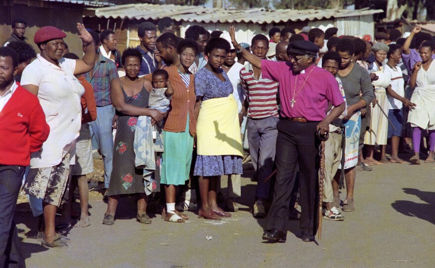 Desmond Tutu greets residents of the Phola Park squatter settlement, east of Johannesburg, in 1990.