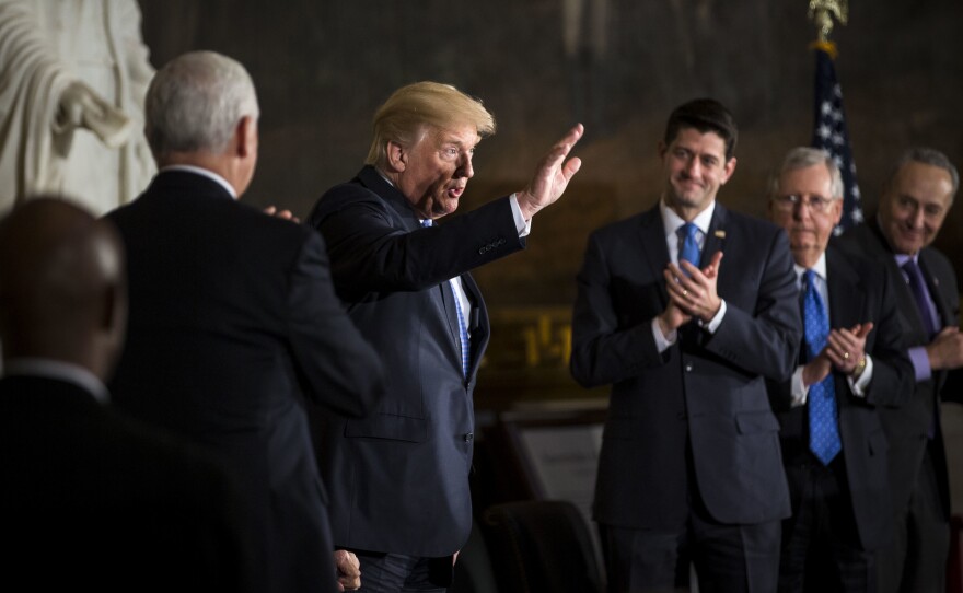 President Trump with congressional leaders on Wednesday during a Congressional Gold Medal ceremony for former Senate Majority Leader Bob Dole at the U.S. Capitol. Thursday, Trump scrambled efforts to negotiate a spending deal with a morning tweet.