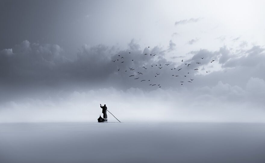 A lone fisherman floats across the Al-Chibayish marshes of the Euphrates river in Iraq.