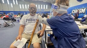 Lawrence Mendoza from Vista get his COVID-19 vaccination at CSU San Marcos, Feb. 22, 2021.