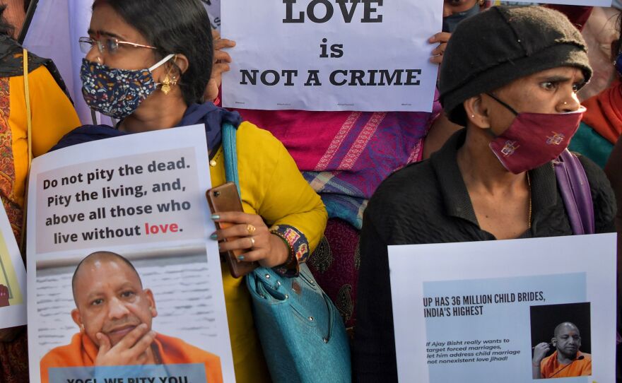 Human rights activists hold placards during a demonstration condemning proposed laws against "love jihad" in various states led by the Hindu nationalist Bharatiya Janata Party, in Bengaluru, India, on Dec. 1, 2020.