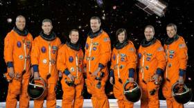 The seven astronauts of the STS-125 crew: Michael Massimino, Michael Good, Gregory Johnson, Scott Altman, Megan McArthur, John Grunsfeld and Andrew Feustel. The STS-125 mission was the final space shuttle mission to the Hubble Space Telescope.