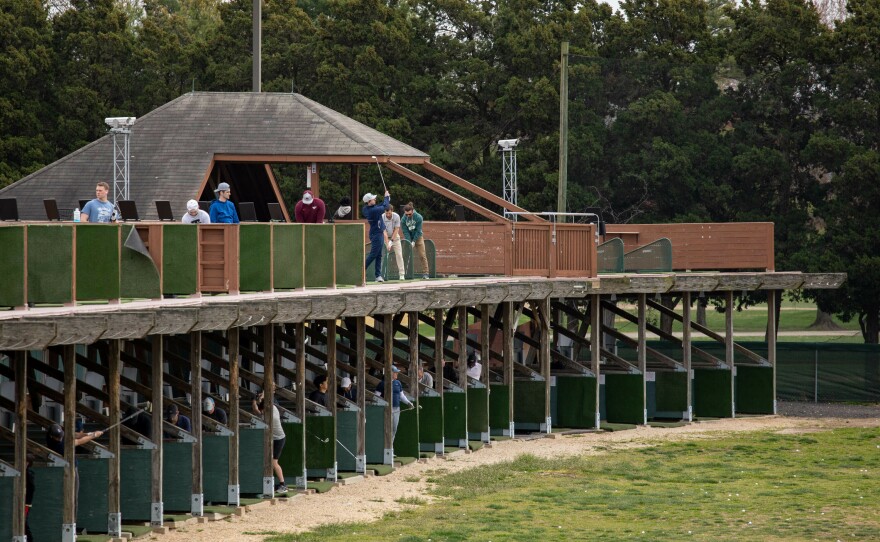 How far can you go? People at the East Potomac Golf Links give it their best shot.