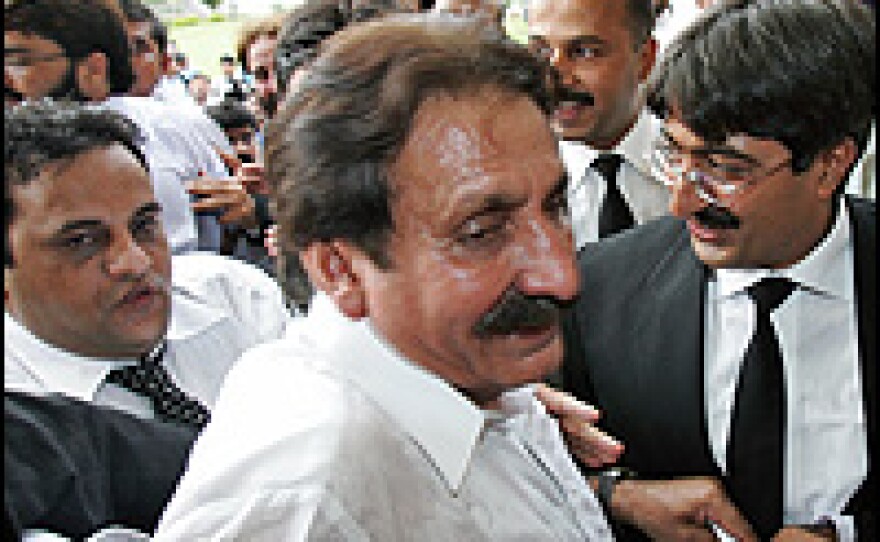 Jubilant lawyers surround reinstated Chief Justice Iftikhar Mohammed Chaudhry inside his residence in Islamabad.
