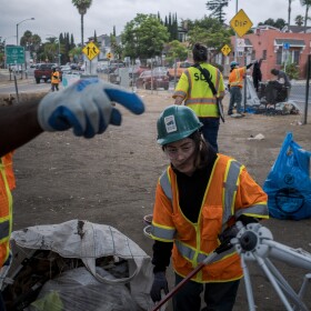 City crews clean up what's left of a homeless encampment near 19th and L Streets in San Diego on Friday, Aug. 15, 2025.